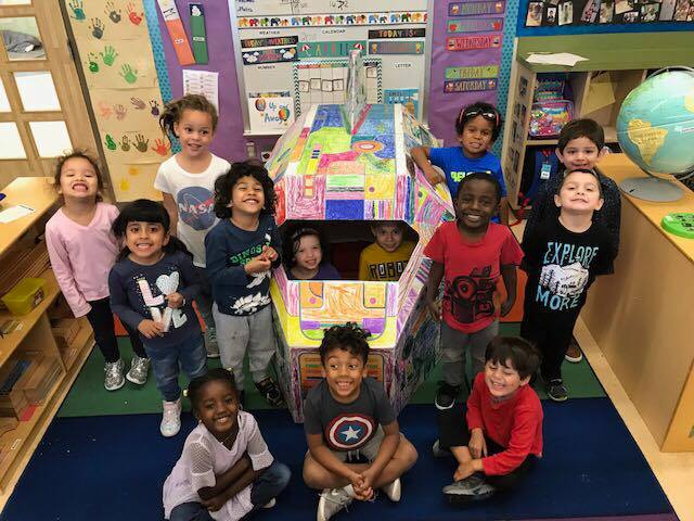 Studnets play on a handpainted spaceship