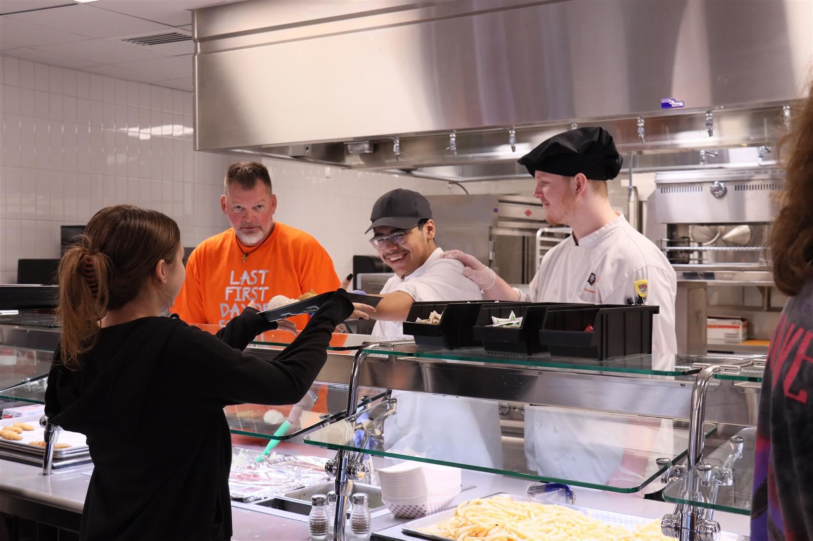 Culinary Student handing our lunch
