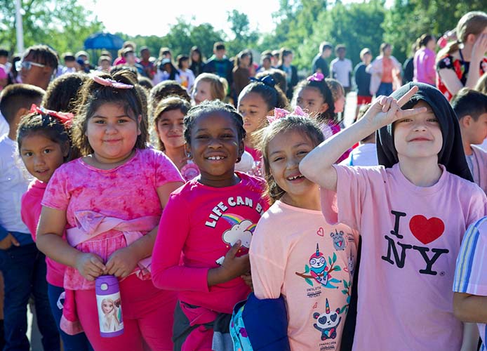 students standing in pink