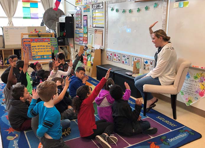 students raising hand