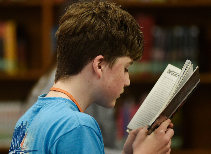 student reading a book