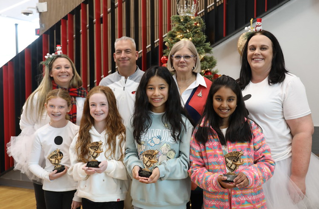 Students and staff with trophies
